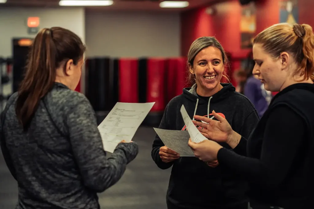 nutrition coach reviewing a meal plan with client